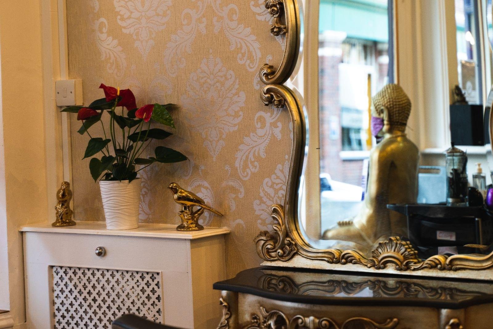 Gold baroque mirror detail in the salon