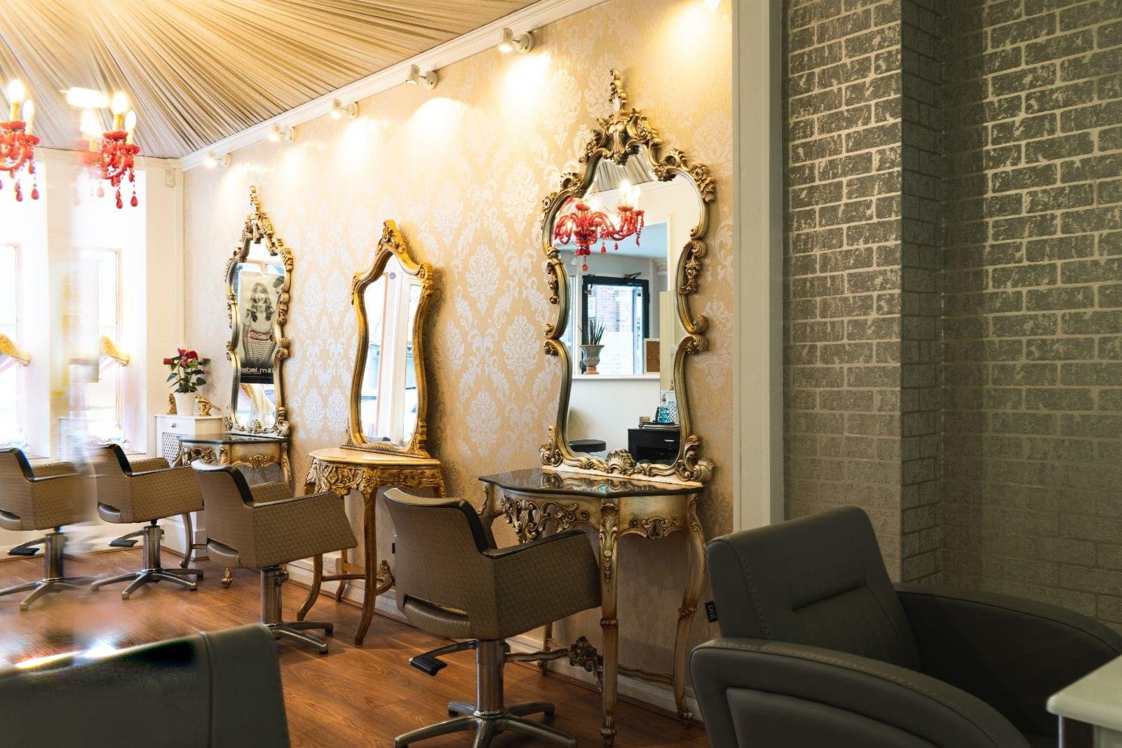 Serenity's salon floor with gold mirrors and chandeliers