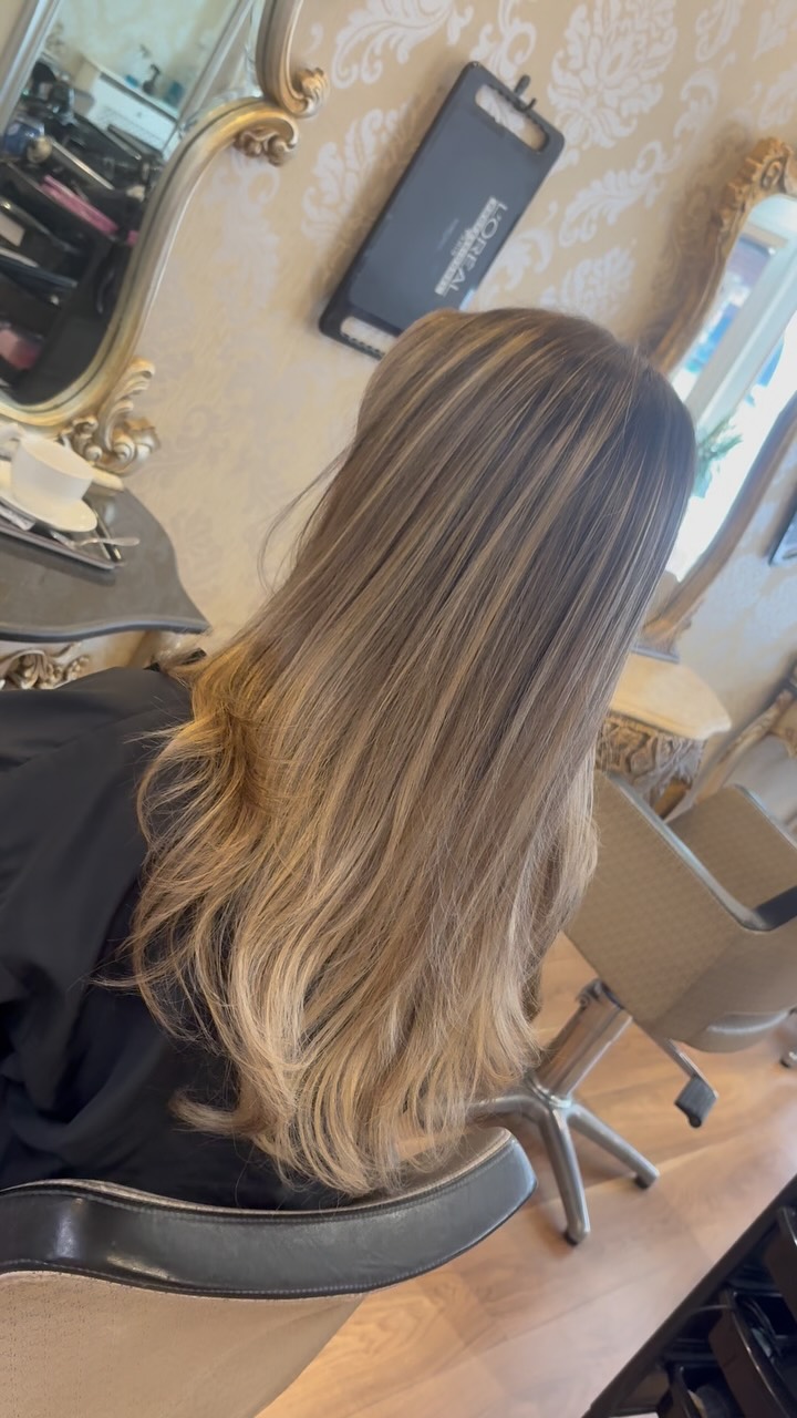 Long hair with a lived-in blonde balayage